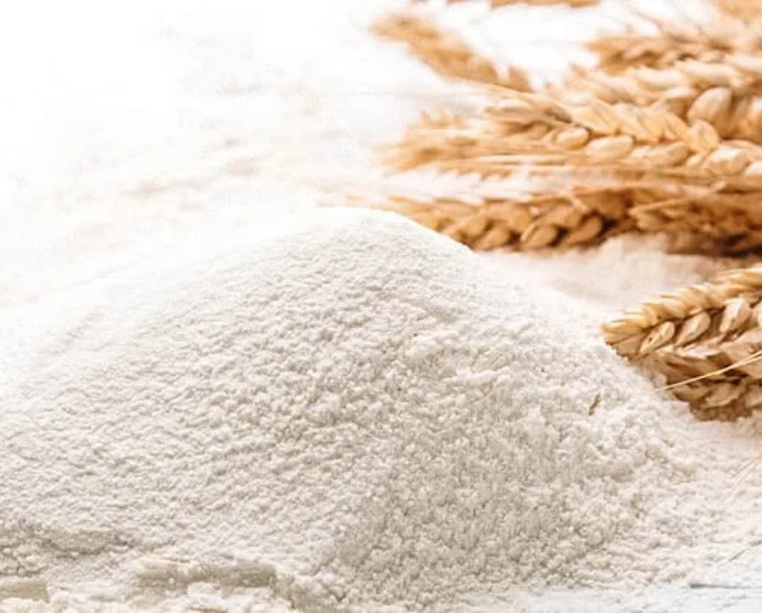 Fresh flour beside whole wheat