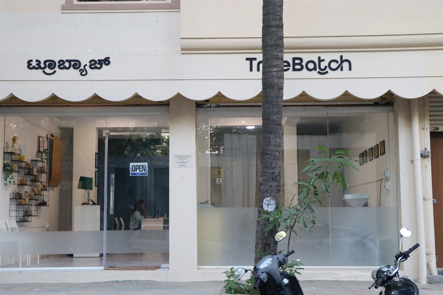The TrueBatch shopfront in Jakkur, its name above a scalloped awning in English and Kannada